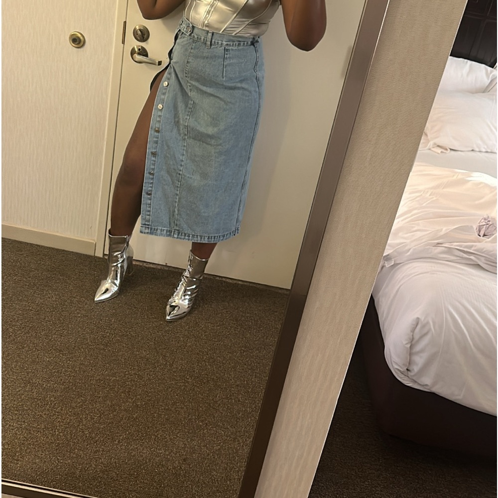 Long denim skirt with buttons. Medium wash
